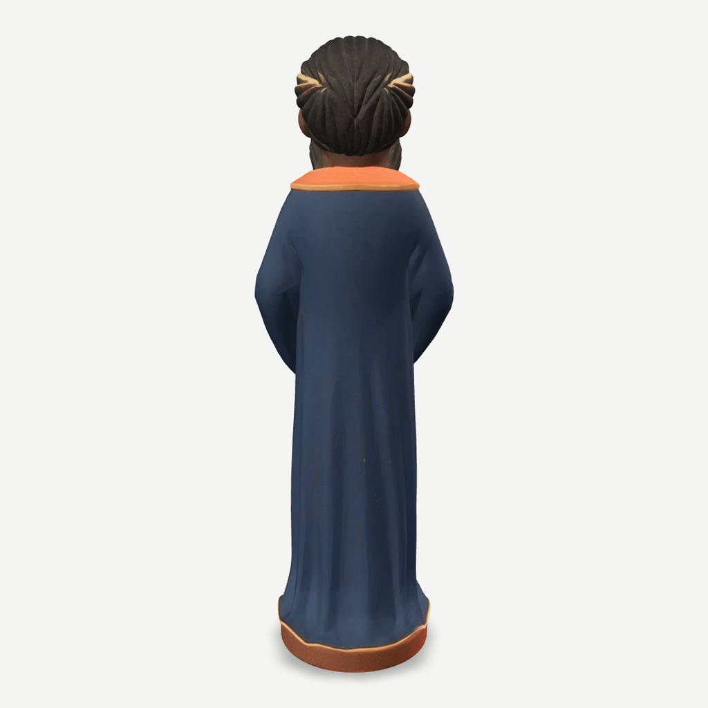 3D printed nativity figurine of Balthazar standing with a jar of myrrh, navy robe and crown — back view