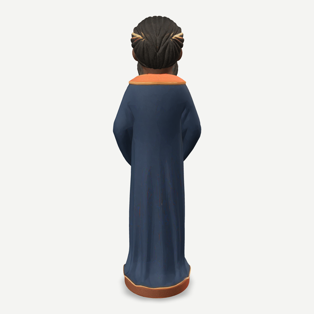 3D printed nativity figurine of Balthazar standing with a jar of myrrh, navy robe and crown — back view