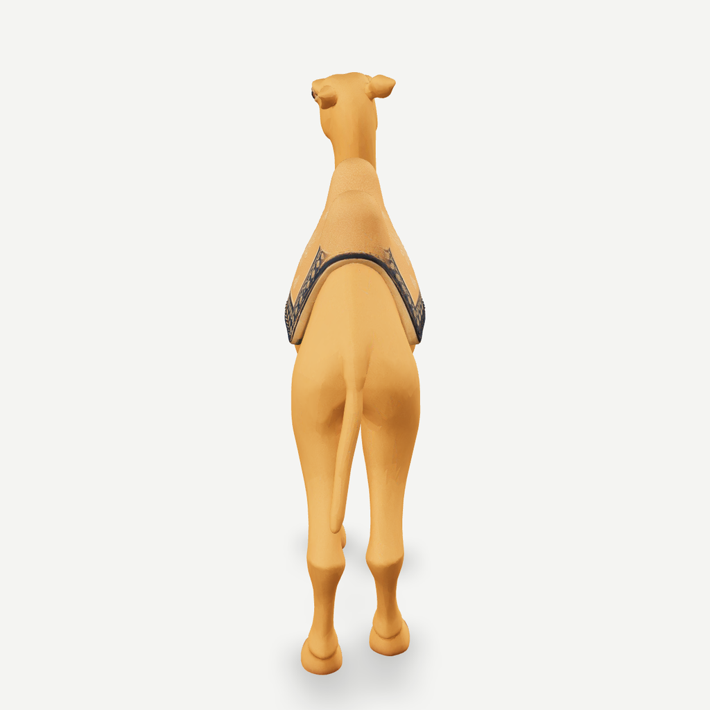 3D printed nativity camel figurine standing with saddle packs, sand-tan finish — back view