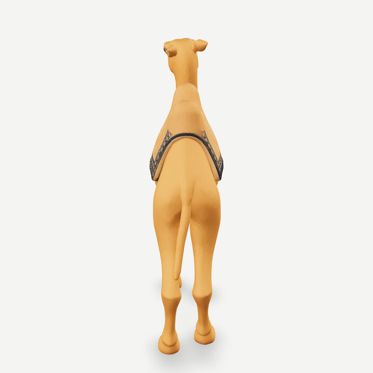 3D printed nativity camel figurine standing with saddle packs, sand-tan finish — back view
